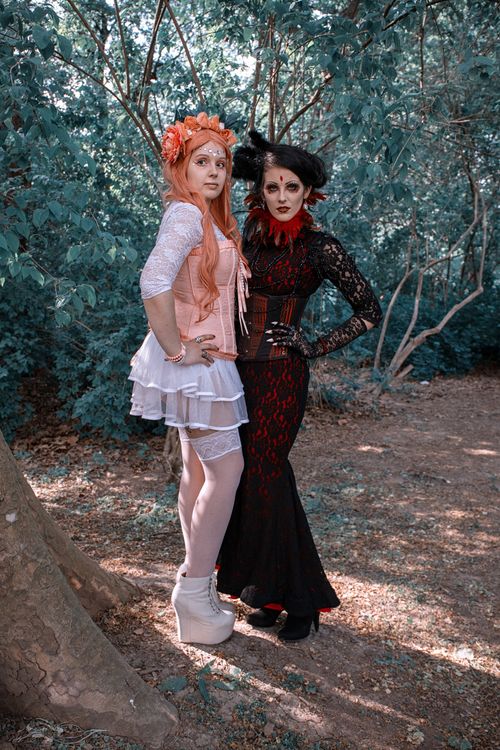 Free Two women in gothic and fantasy cosplay posing in an enchanted forest setting in Leipzig. Stock Photo