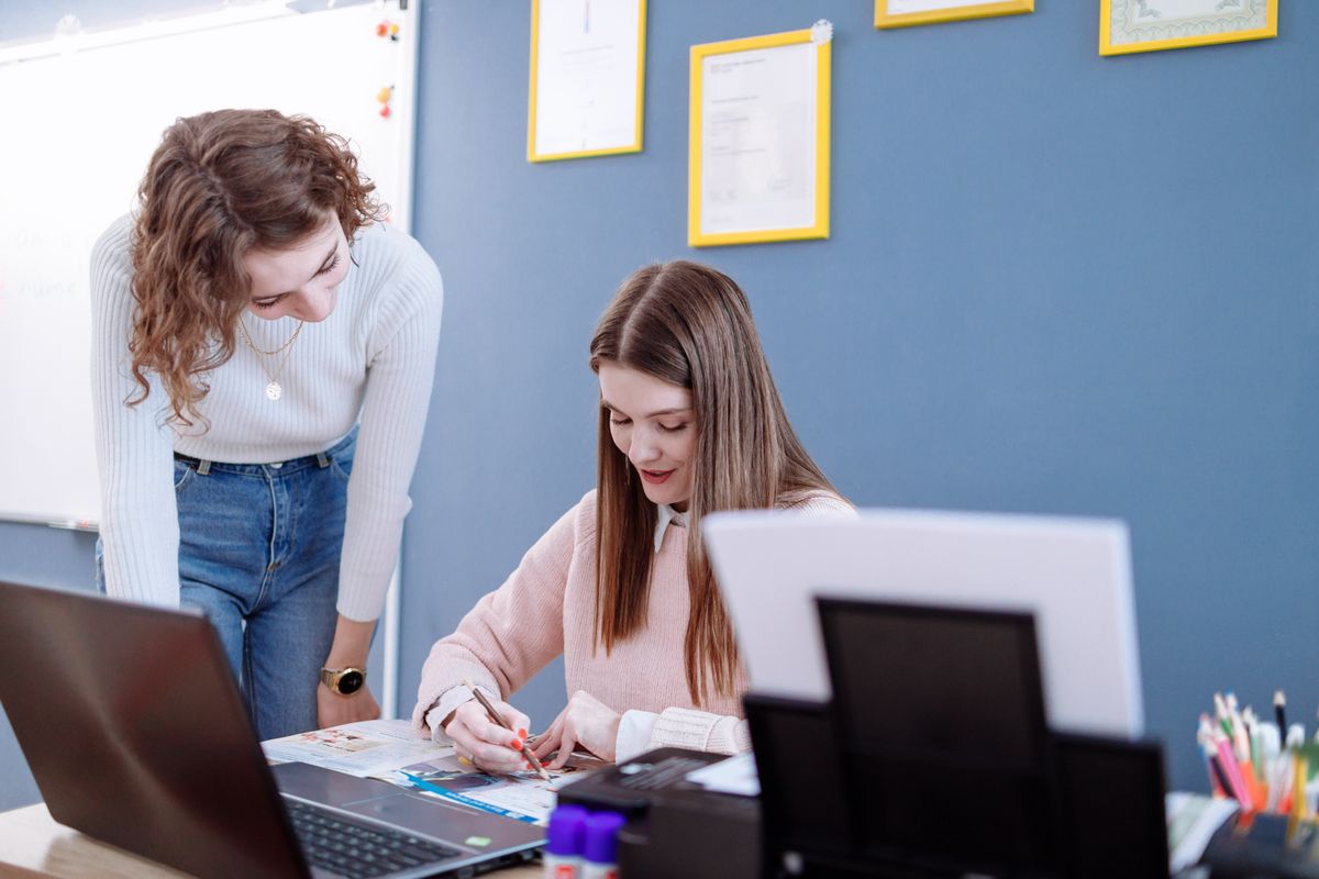 Tutor helping a student with their work