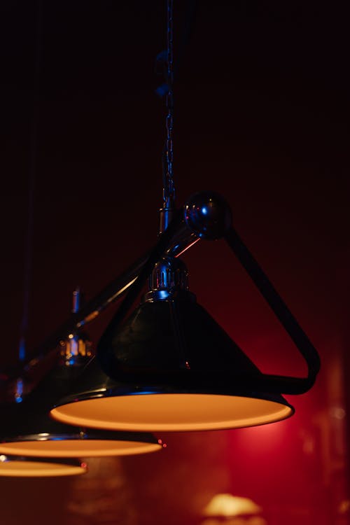 A Black Lamp Lights Hanging with a Chain