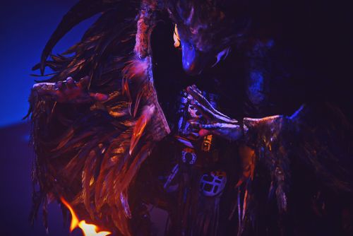 Free Close-up of a spooky feathered costume with eerie lighting, capturing a mysterious and creepy atmosphere. Stock Photo