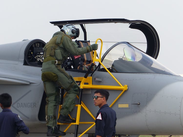 Soldier Entering Fighter Jet Cockpit