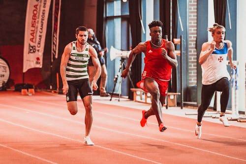 Men Running on Track Field