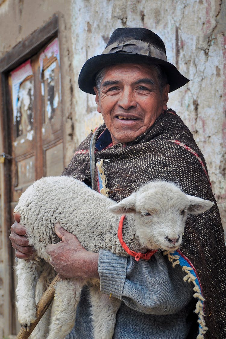 Man Carrying A Lamb