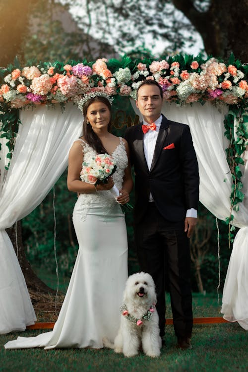 Newlywed Couple Posing with Their Pet Dog