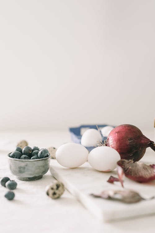 Red Onion, Eggs And Blueberries On Table