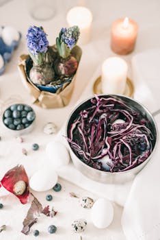 Easter eggs prepared with natural red cabbage dye and spring decorations.