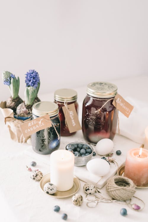 Three Glass Jars With Liquid On Table