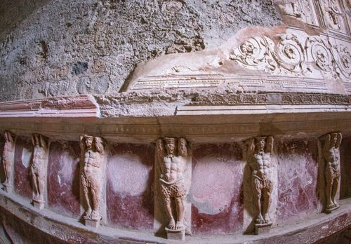 Free Detailed view of ancient stone carvings on a historic facade with artistic motifs. Stock Photo
