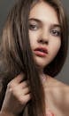 Close-Up Photo of Girl holding Her Hair