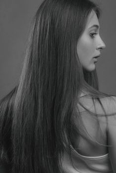 Monochrome profile portrait of a woman with long hair in Kyiv.