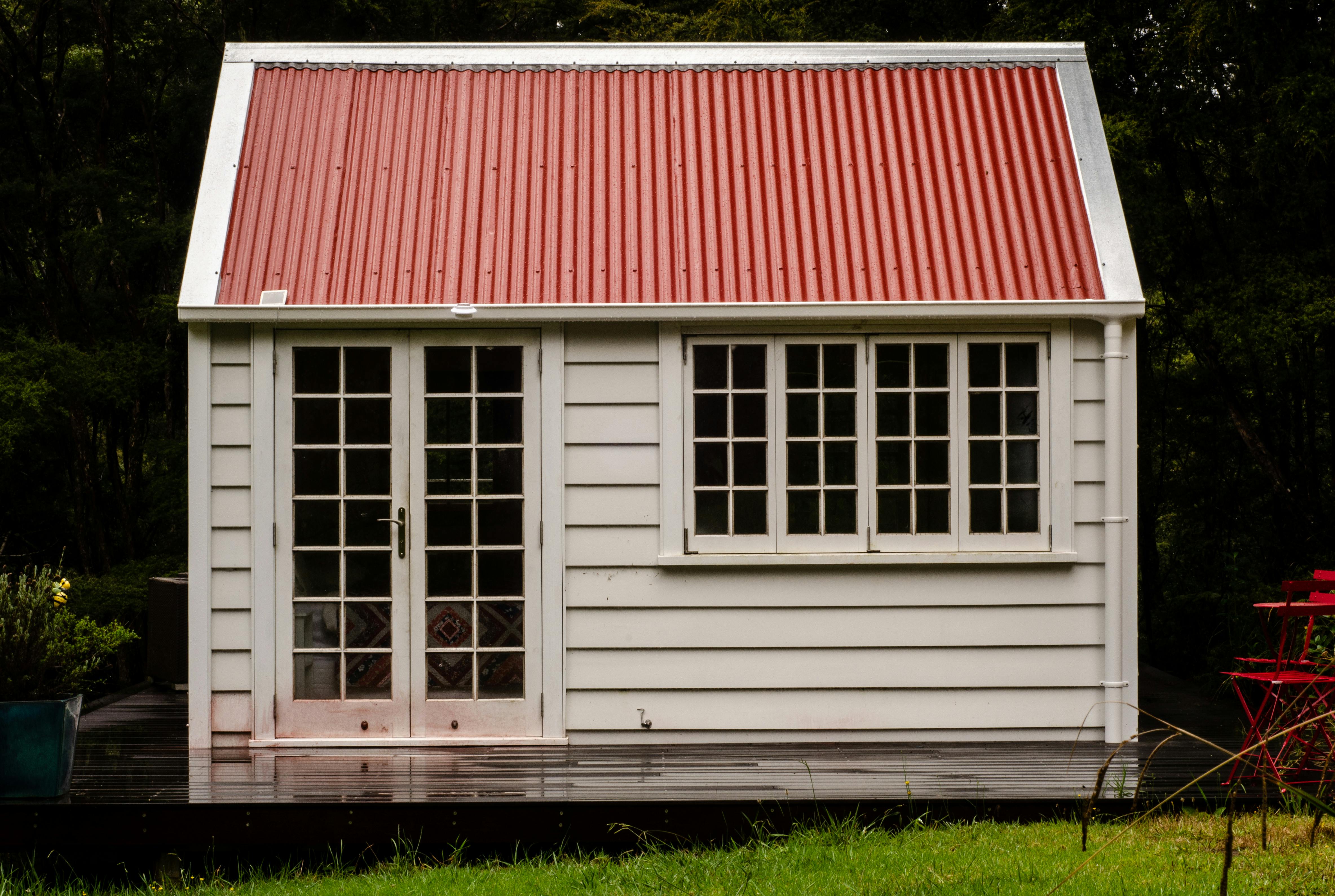 Explore this quaint rustic cottage with a red roof in Northland, New Zealand.