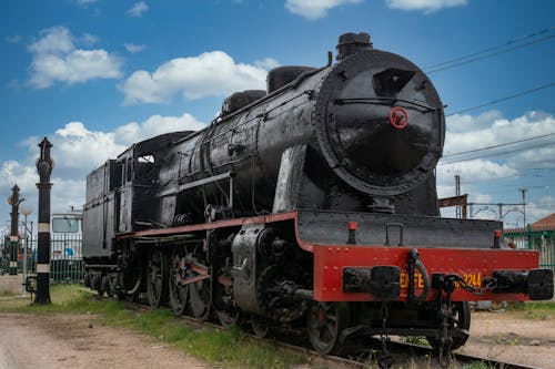 Free Black and Red Train Under Blue Sky Stock Photo