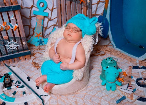 Free A Sleeping Baby Wearing a Costume Stock Photo