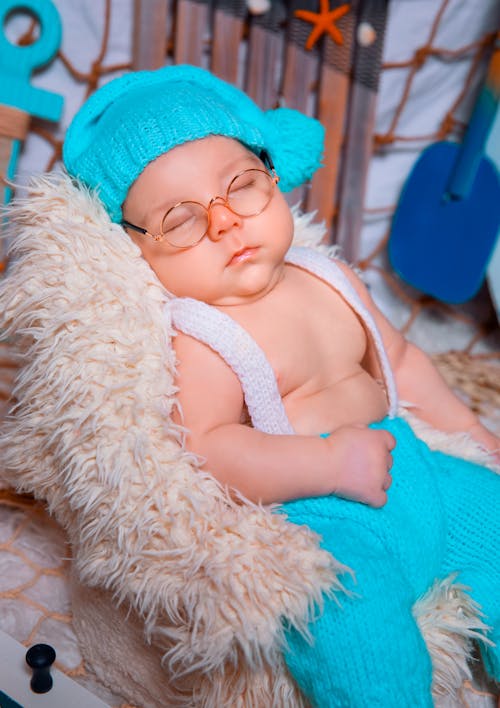 Free A Close-Up Shot of a Sleeping Baby Wearing a Costume Stock Photo