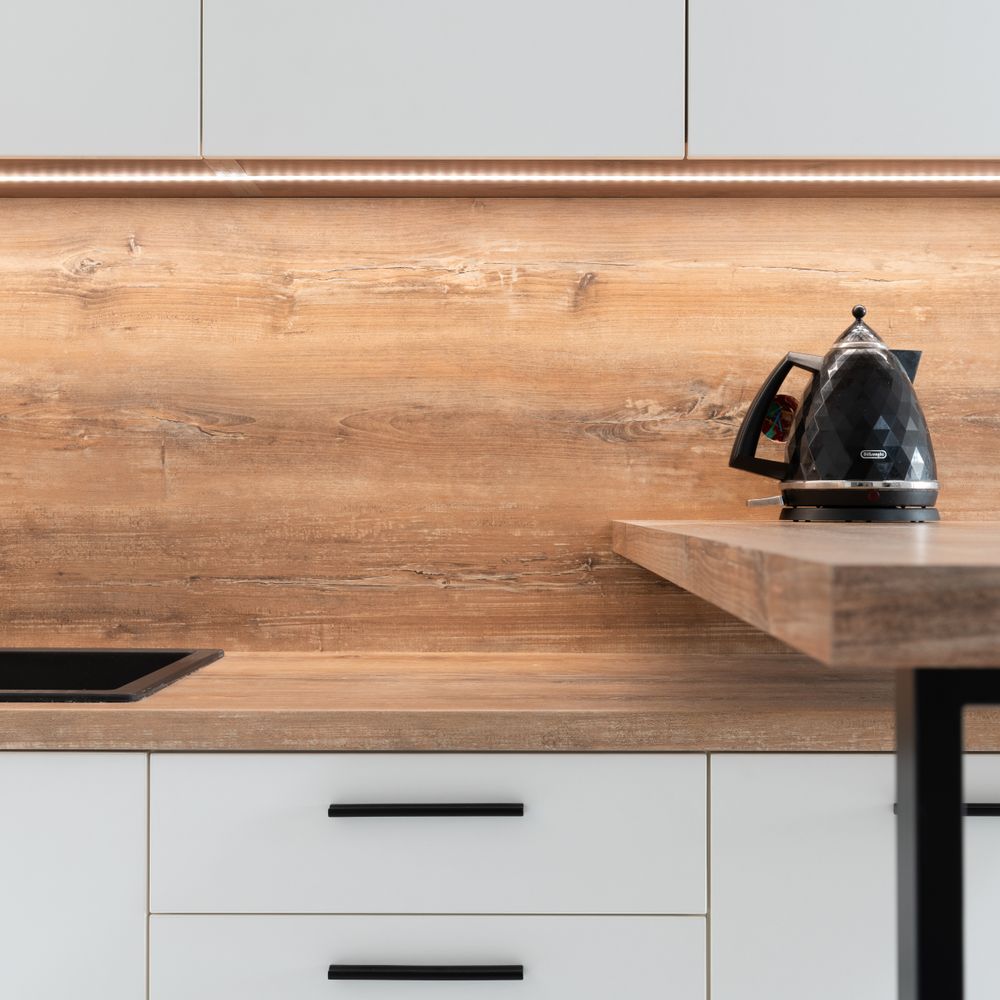 Kitchen Spraying in East Dulwich — careful masking before painting begins
