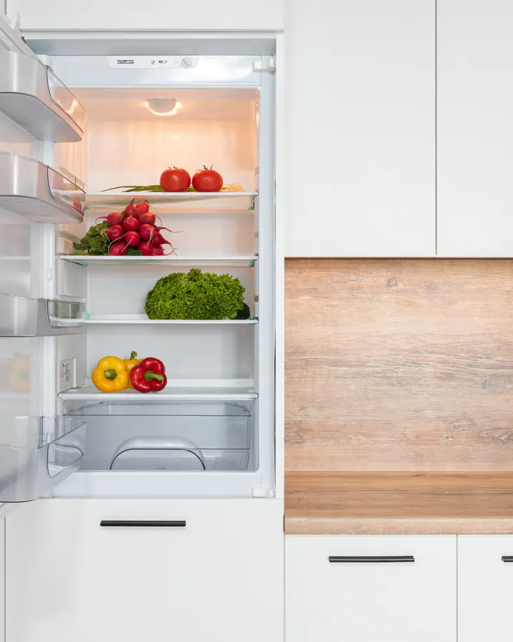 French Door Refrigerator Repair in La Mesa, CA Contemporary kitchen with a French door refrigerator full of fresh tomatoes and lettuce in La Mesa