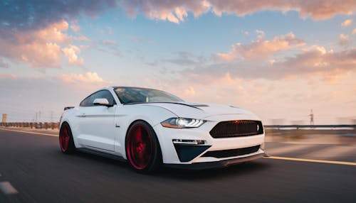 White Mustang on Asphalt Road