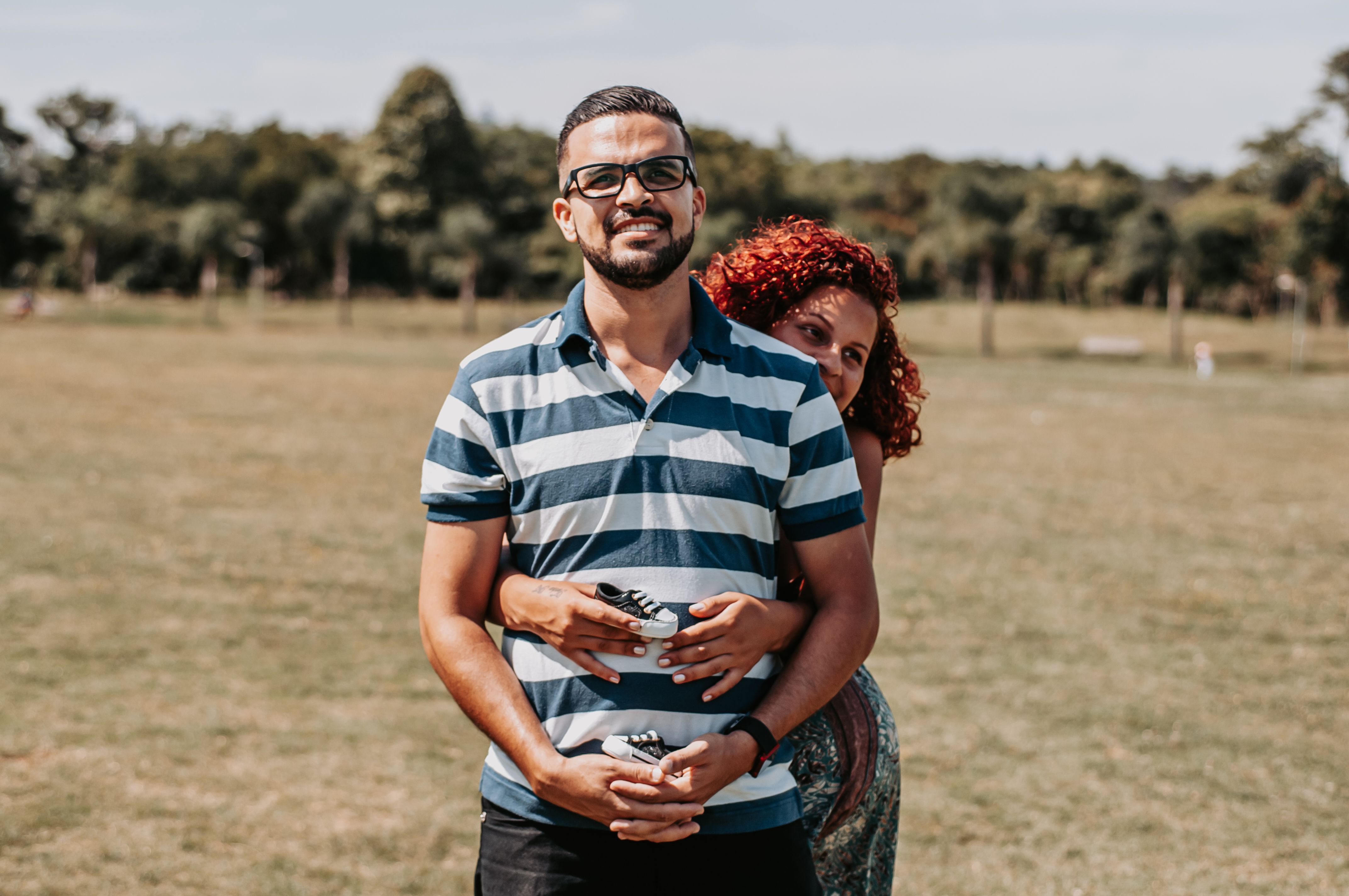 Sweet Woman hugging her Man from Behind · Free Stock Photo