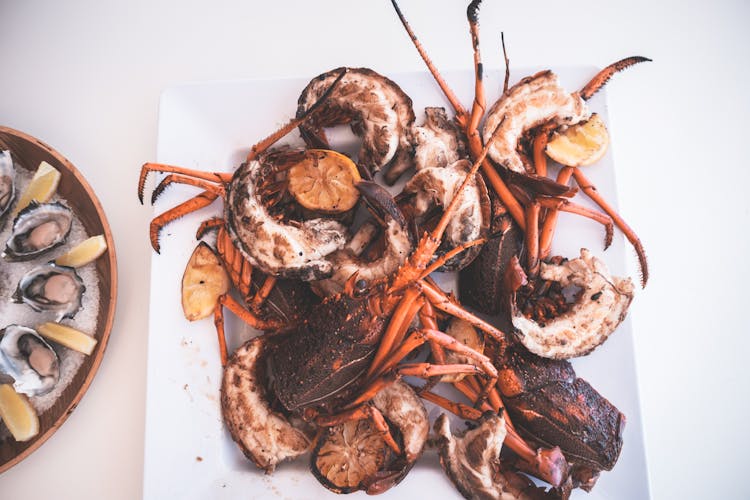 Yummy Grilled Spicy Lobsters Served On Table In Restaurant