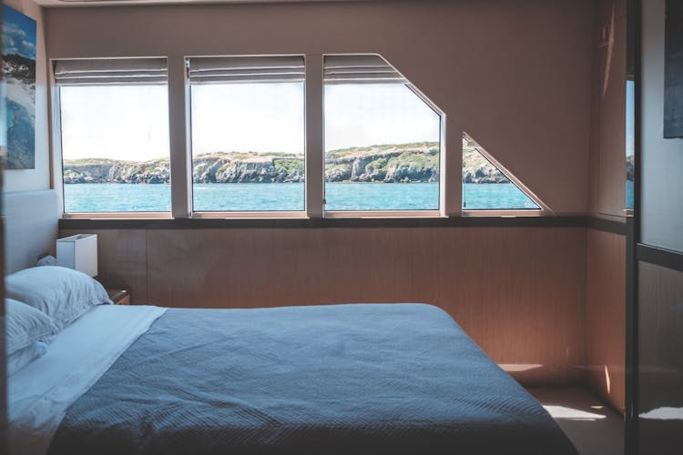 Comfortable Bed In Boat Cabin During Cruise