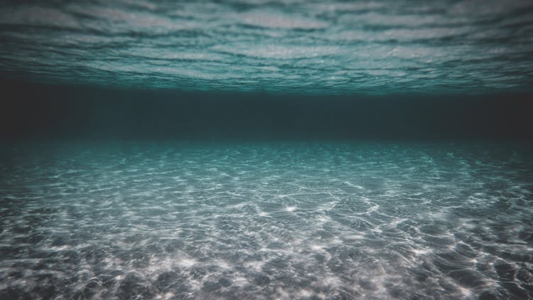 Underwater Of Turquoise Ocean With Sandy Bottom