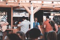 People gathering near counter at festival