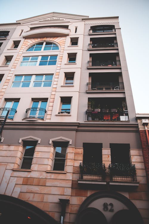 Tall majestic residential concrete building with balconies