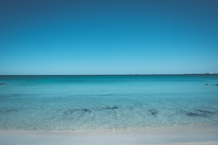 Peaceful Azure Sea Under Cloudless Bright Blue Sky