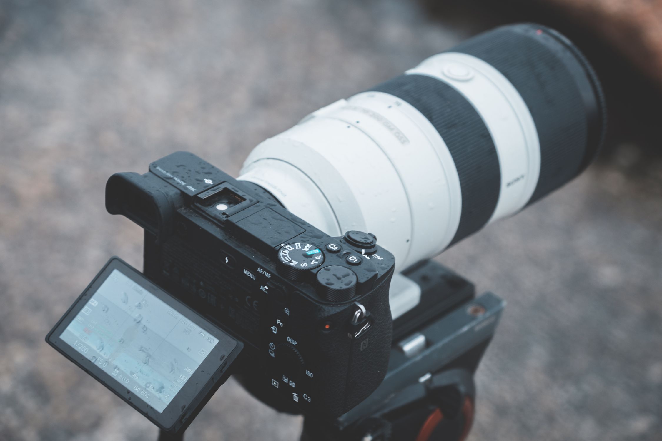 Long Objective Camera Professional photo camera with long focus lens placed on street · Free ...