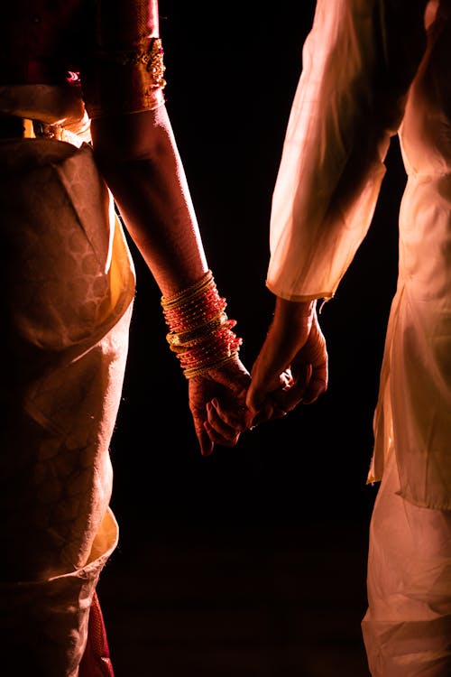 Free stock photo of backlight, holding hands, indian couple