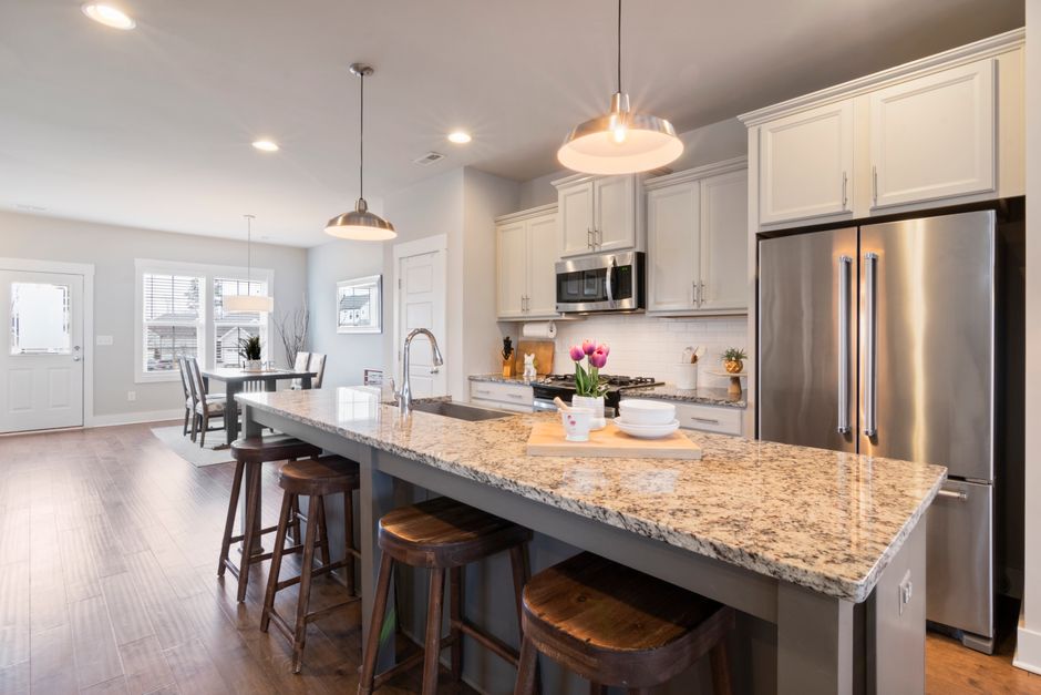 Beautiful modern kitchen with granite countertop and stainless steel appliances.