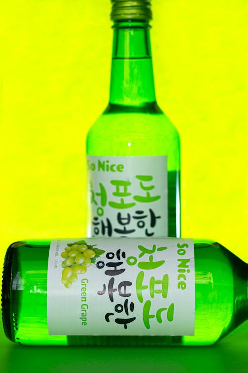 Free Two Glass Bottles of So Nice Green Grape Soju Stock Photo