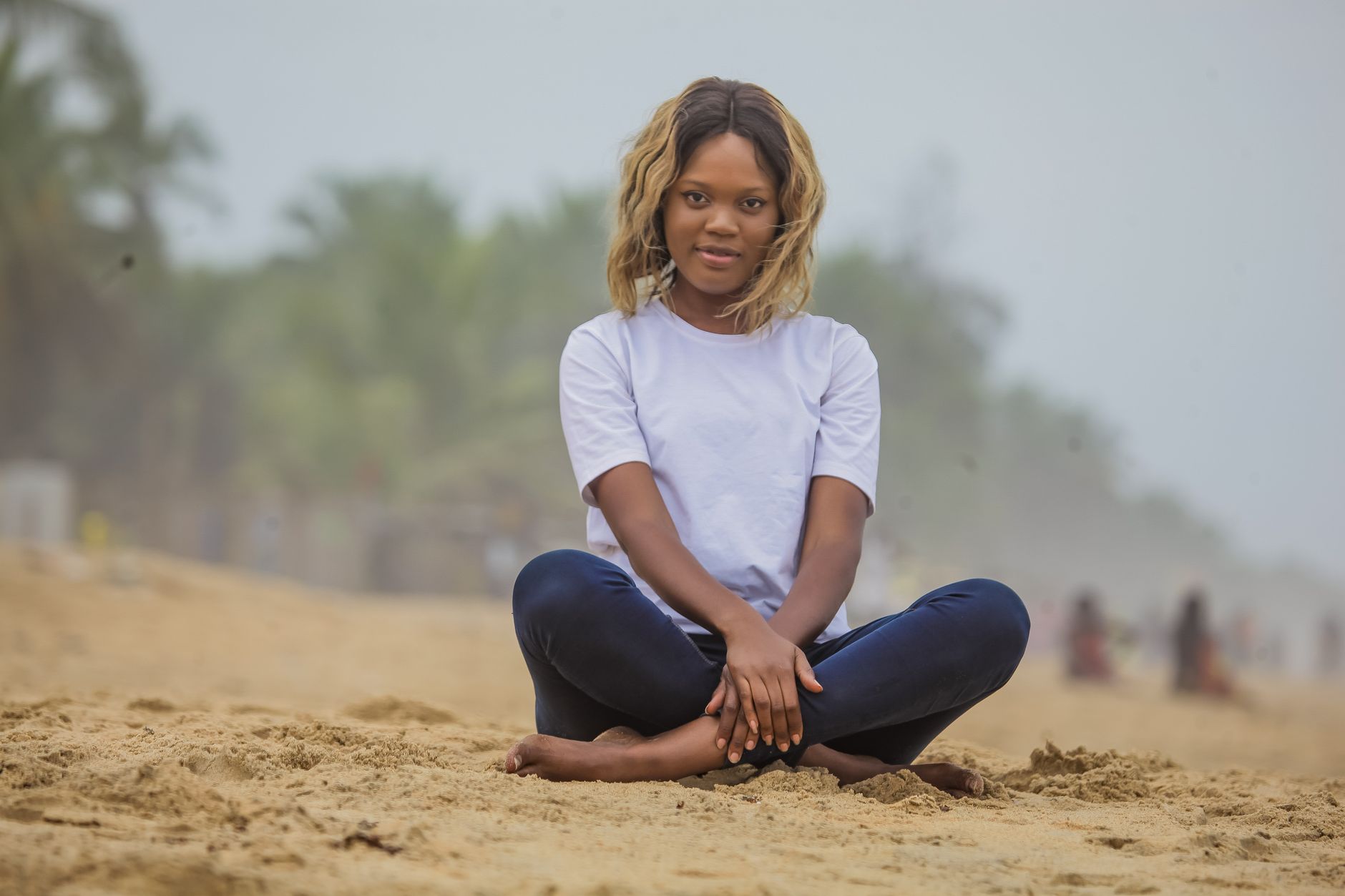 Woman walking outside a Lekki hotel entrance in daylight