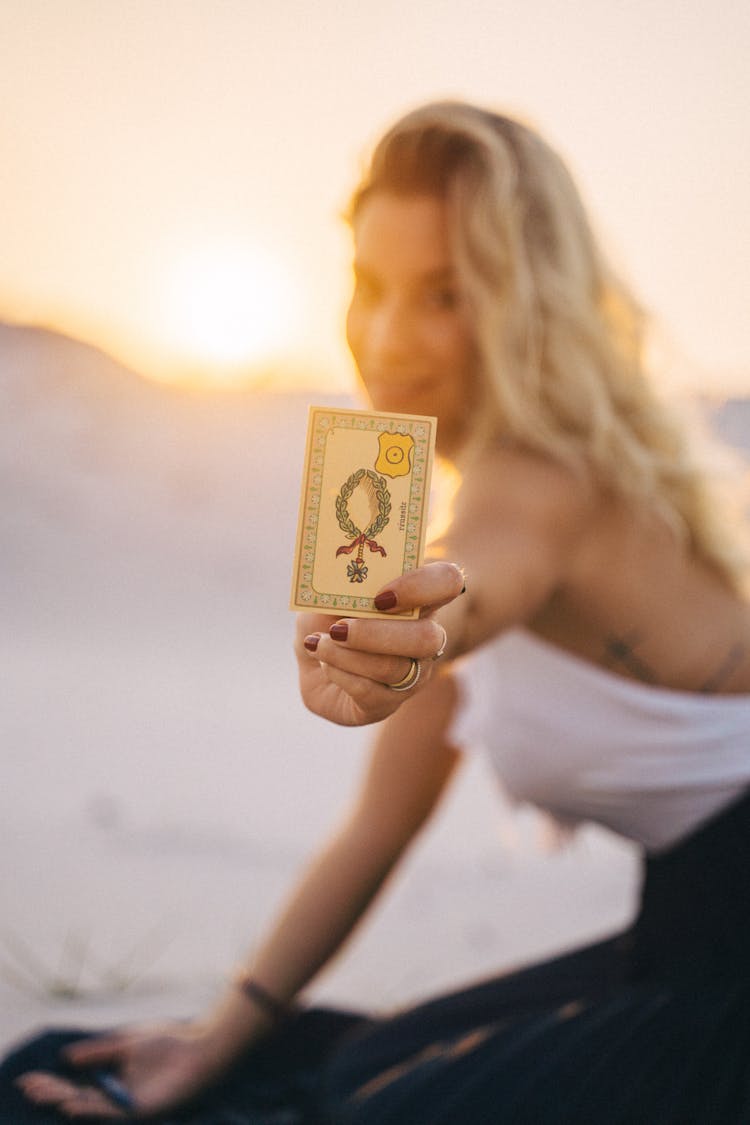 Woman Showing A Tarot Card