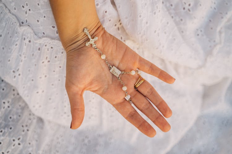 Close-Up Shot Of A Person Holding A Cross