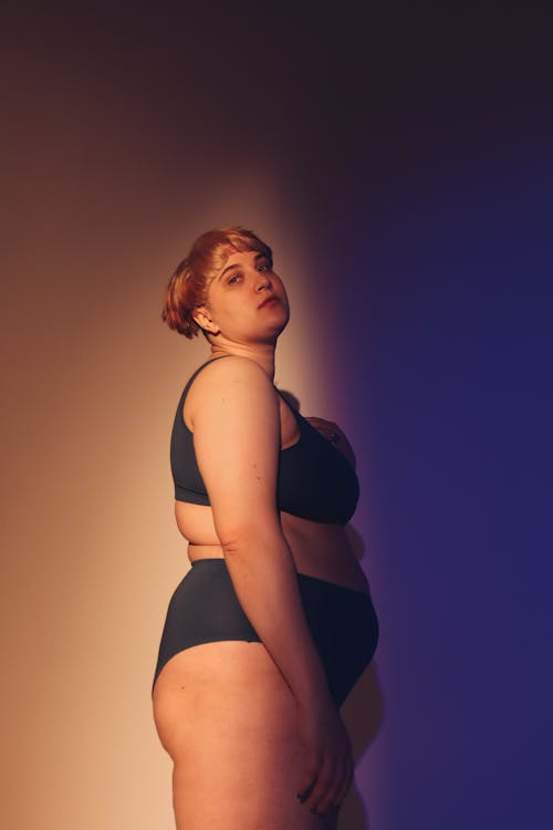 Side View of a Woman Posing in Underwear