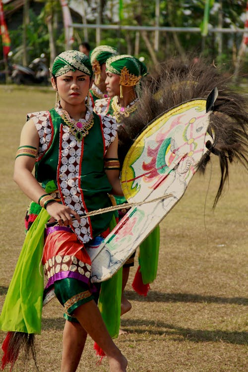 A Person in Traditional Clothes Celebrating Kuda Lumping Festival