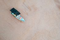 Old boat on empty sandy shore