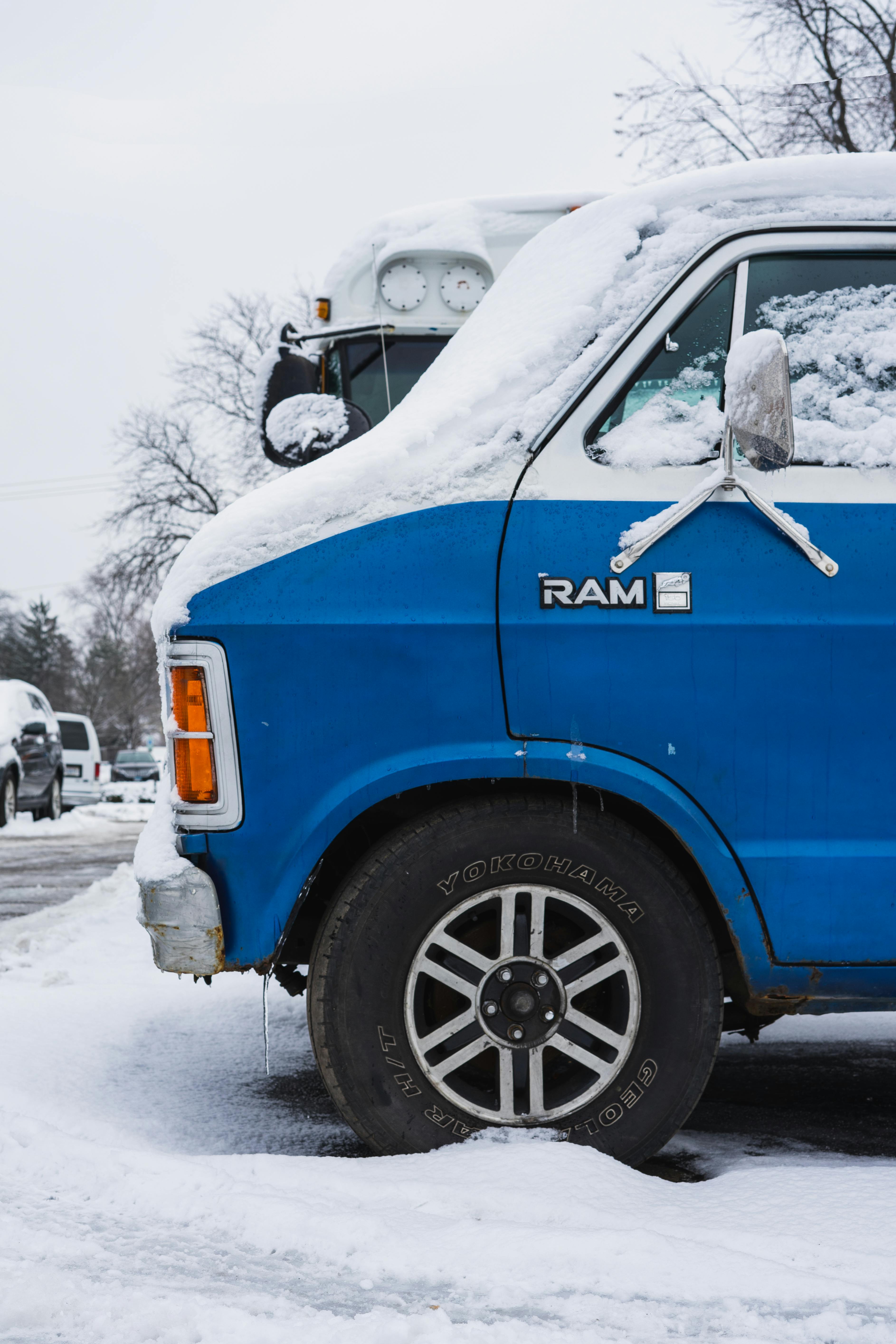 side view of a snow covered van