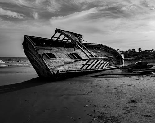 Abandoned Old Wooden Boat on Shore