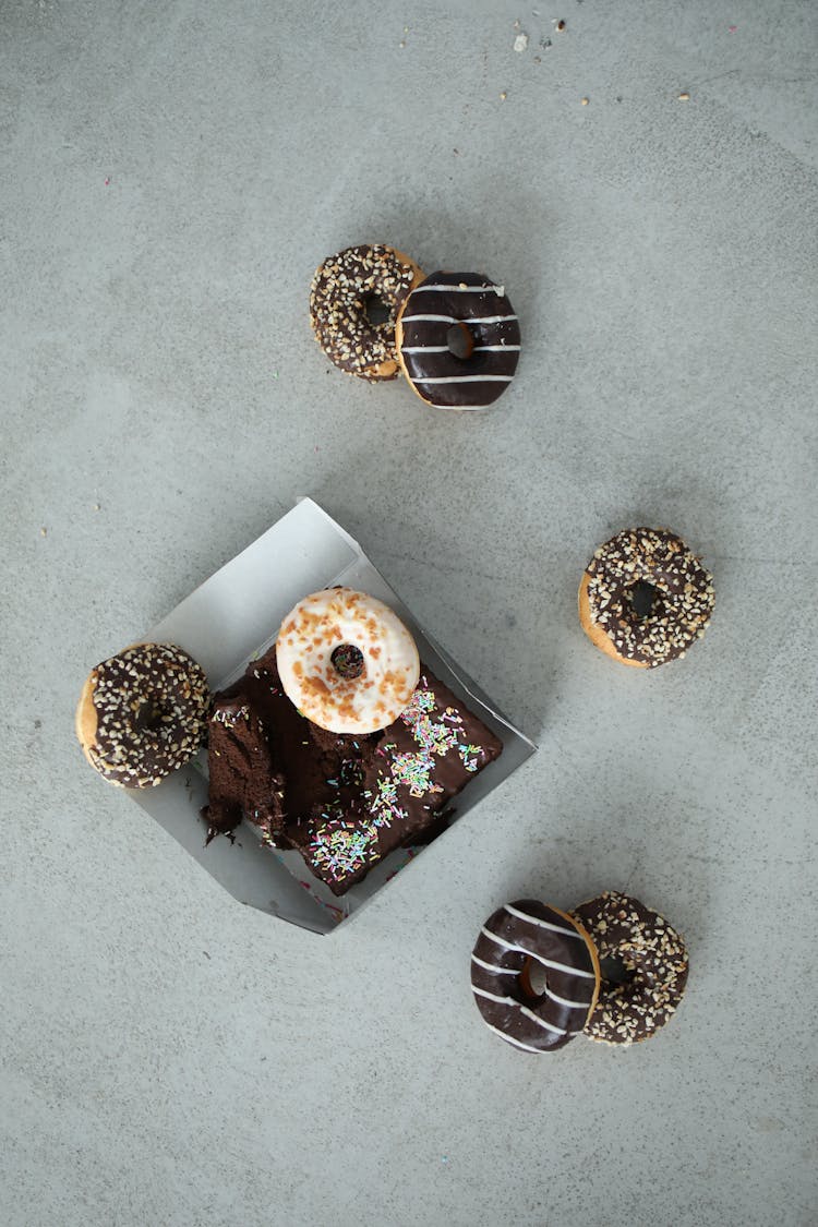 Overhead Shot Of Donuts And A Cake