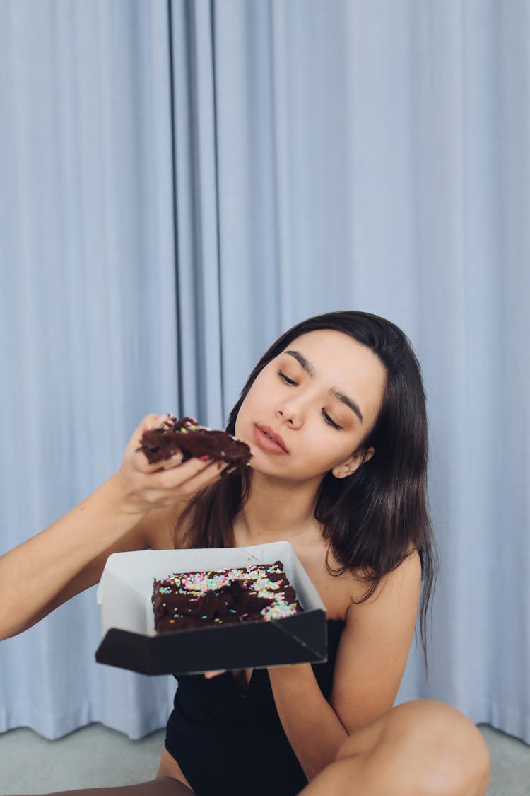 Woman Eating Chocolate Cake