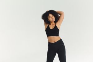 Woman in black activewear in a studio — Polina Tankilevitch on Pexels