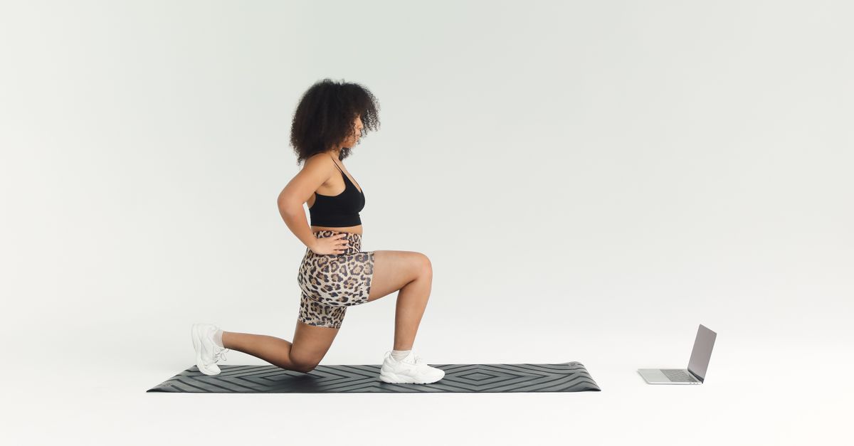 person doing a HIIT workout with a timer in the background