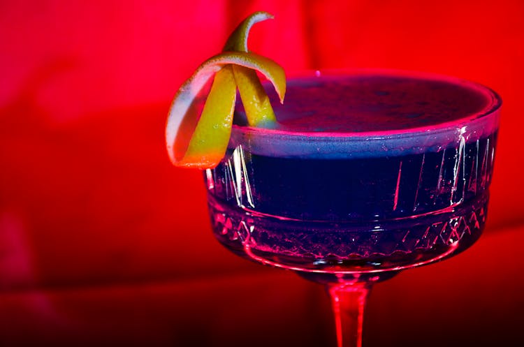 Blue Cocktail In Glass On Red Background