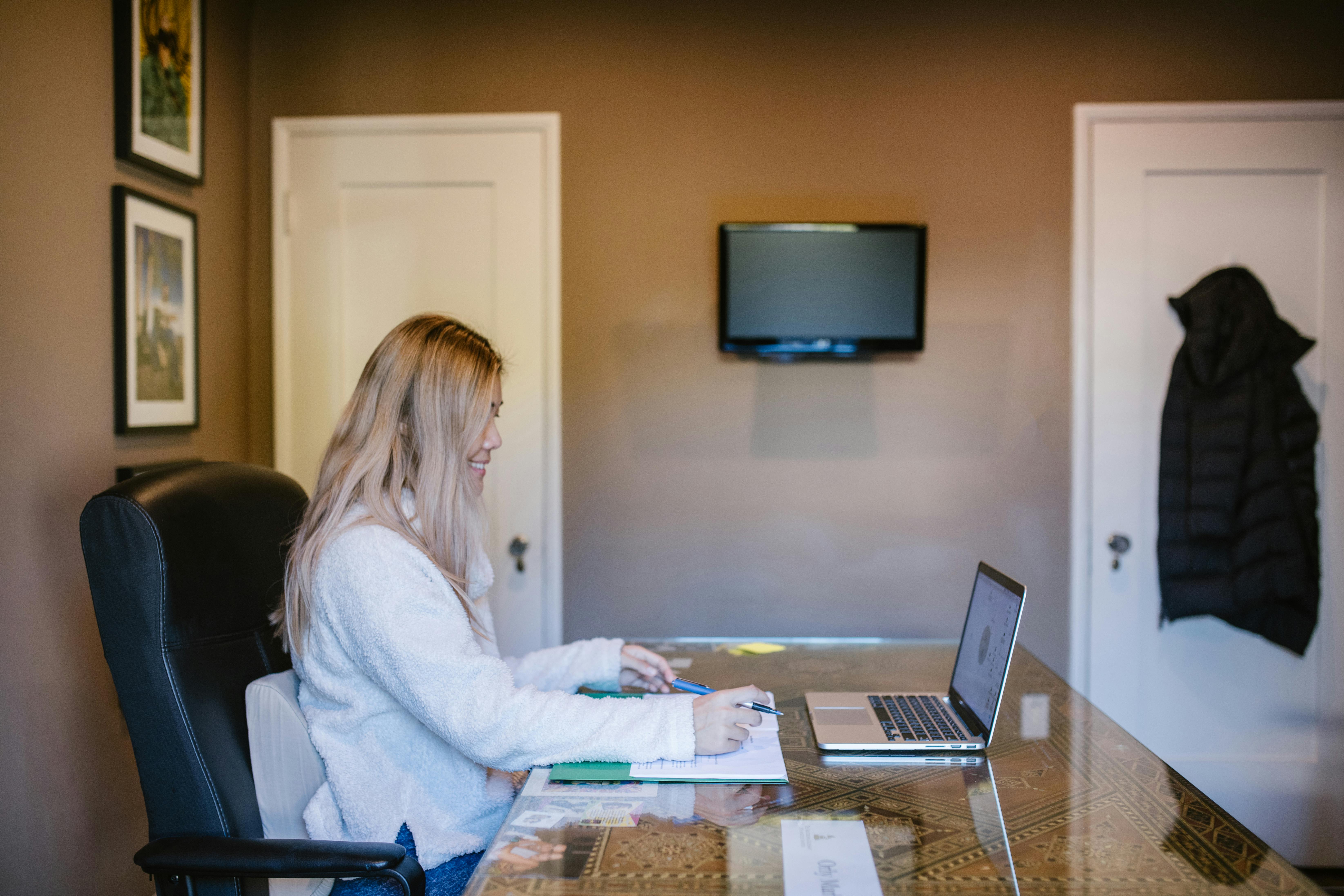 people woman desk laptop