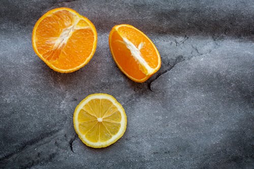 Free Sliced juicy oranges and lemon Stock Photo