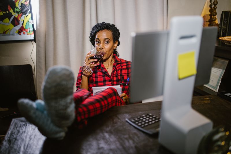a parent talking calmly to a child near a home desk