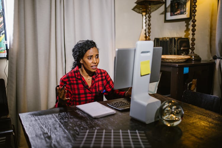 A Woman Talking While Facing The Monitor