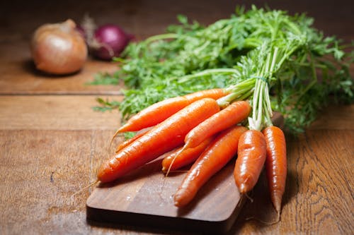 8 Piece of Carrot on Brown Chopping Board